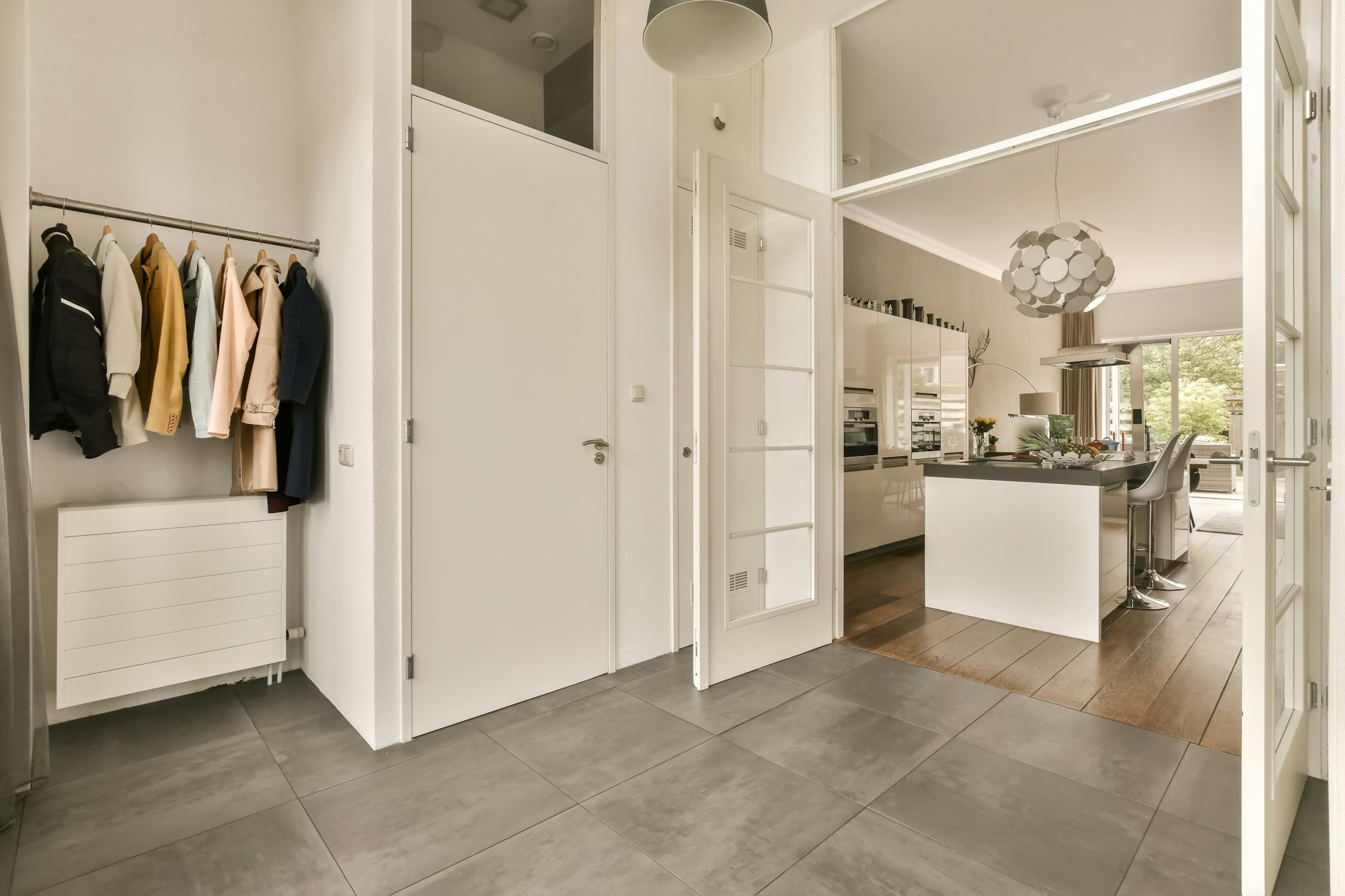 a walk in closet in a kitchen with a counter